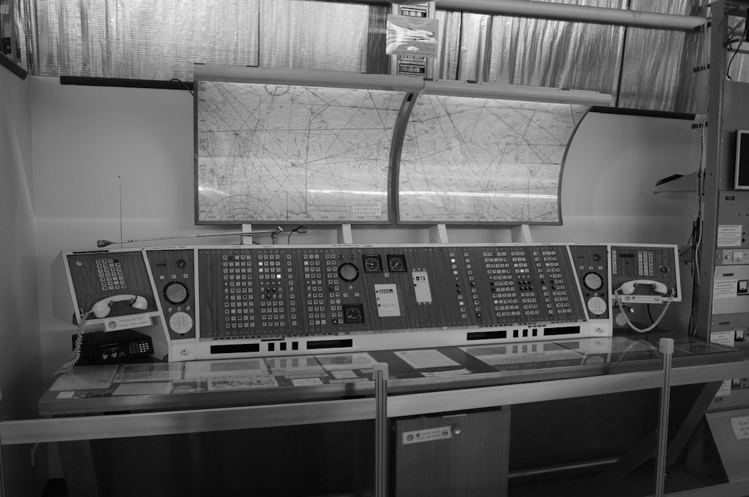 Broadcast control room with multiple video screens and live switching console