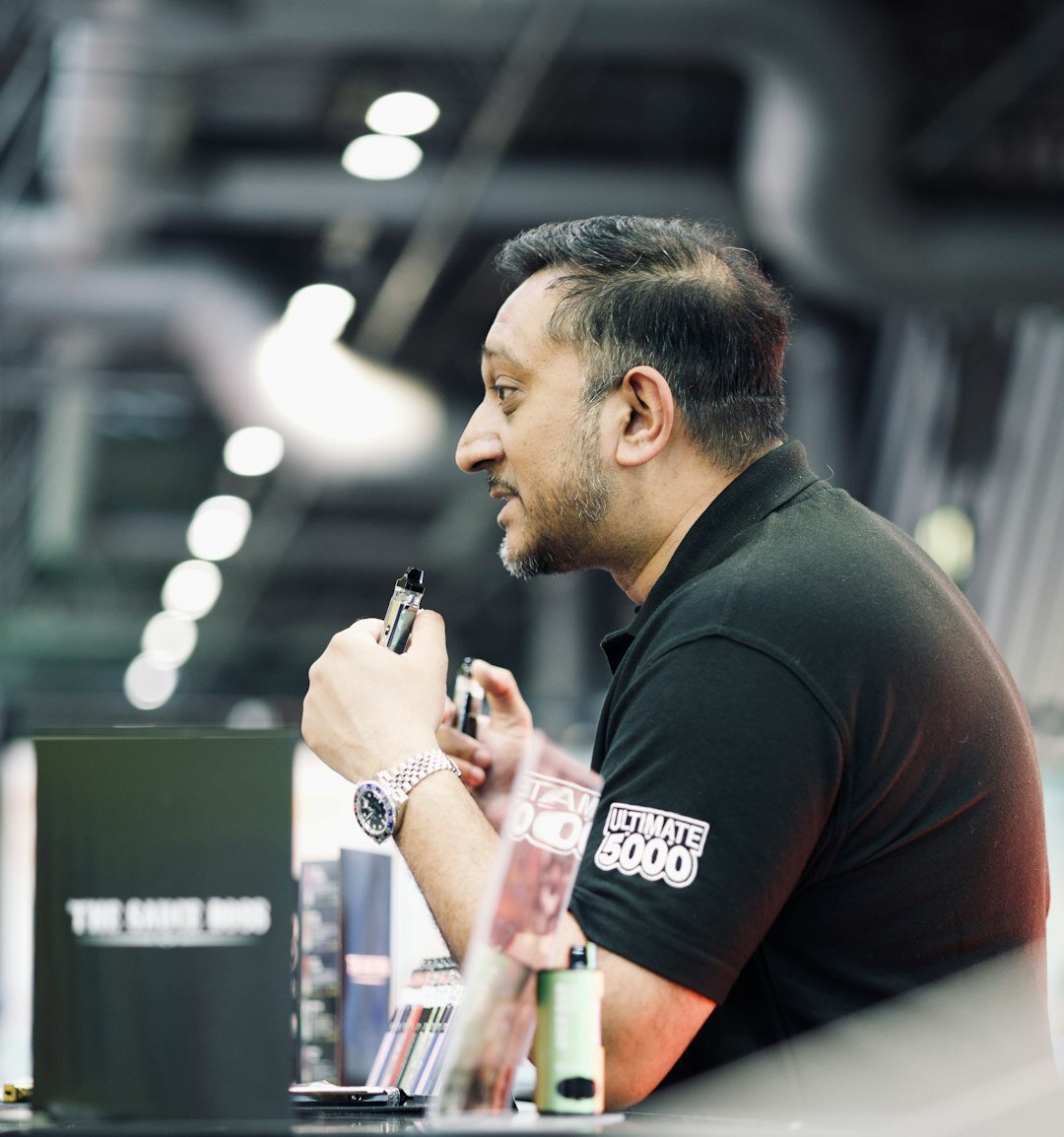 Portrait of a Belgian man in his 40s, technical director, headset around neck